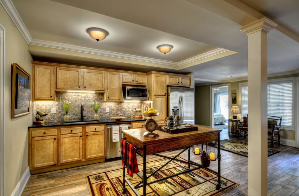 Lower level kitchen with fridge, sink, dishwasher