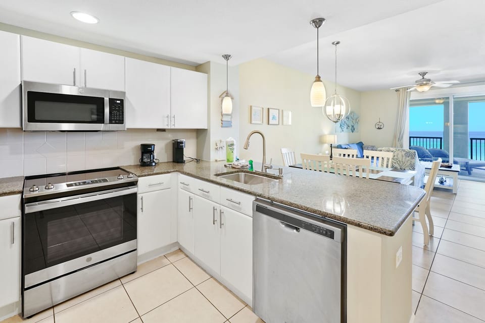 Your fully-equipped kitchen makes vacation dining effortless with granite counters, stainless appliances, and ocean views.