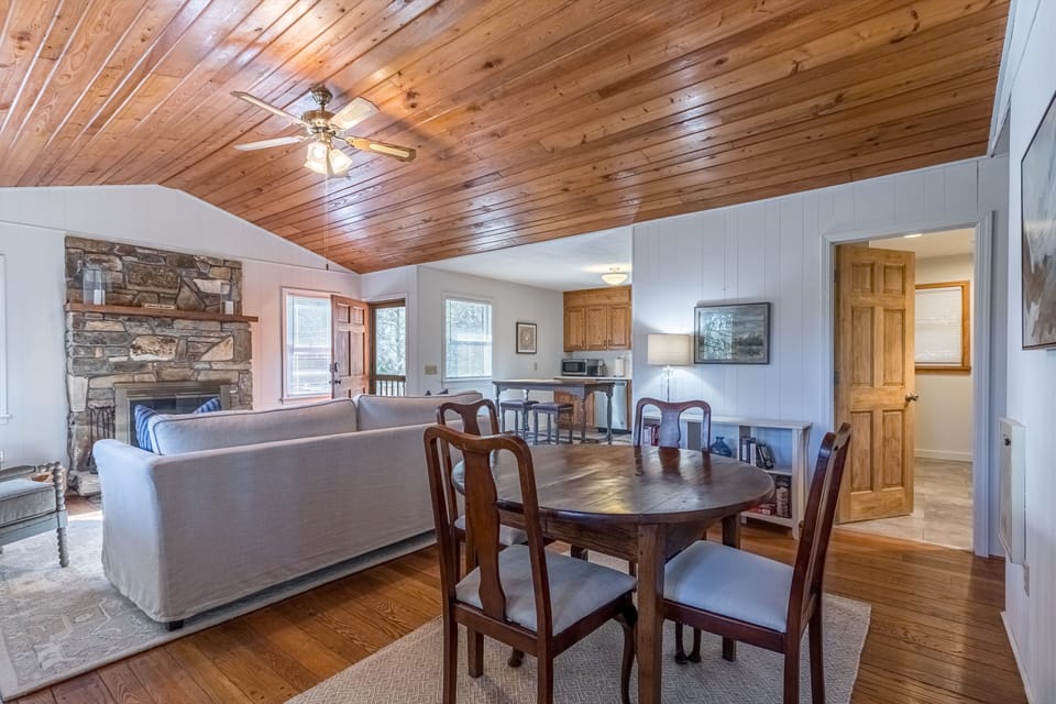 Living room has a smart tv, books, puzzles, & board games for relaxing evenings.