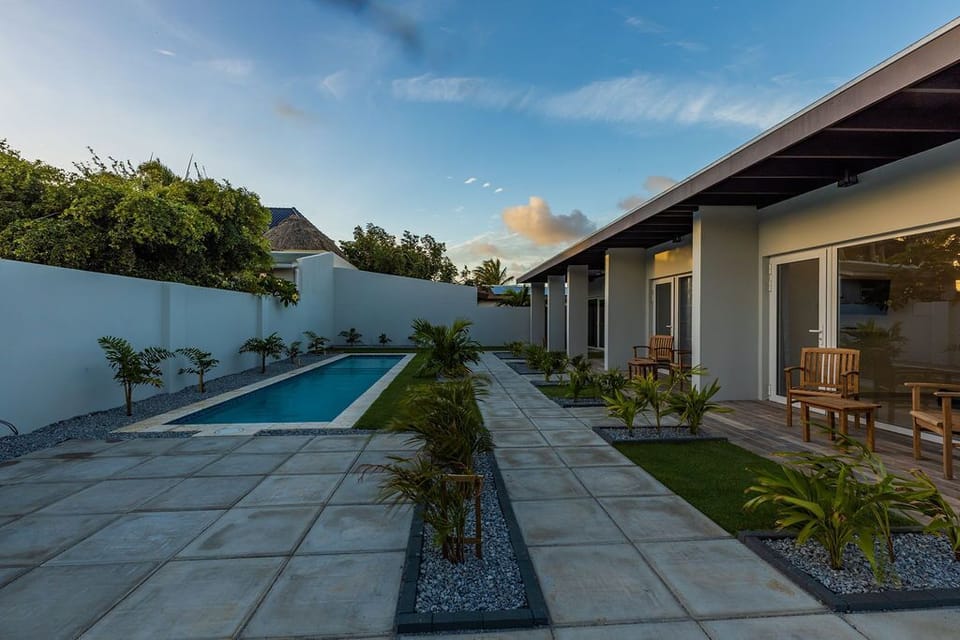 This is a NEW modern one bedroom apartment in a small private complex with four apartments in an amazing location. 
There is a shared pool and laundry area, great WiFi and air conditioning throughout, and control for each area.