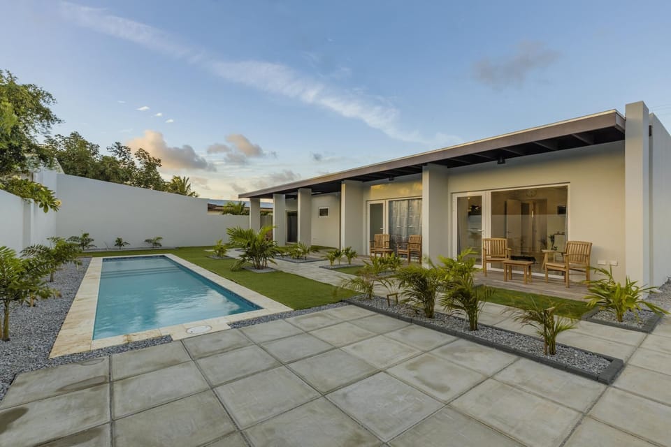 This is a NEW modern one bedroom apartment in a small private complex with four apartments in an amazing location. 
There is a shared pool and laundry area, great WiFi and air conditioning throughout, and a control for each area.