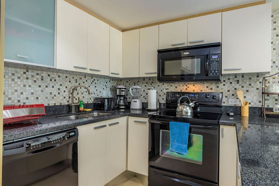 A complete kitchen with a bar.