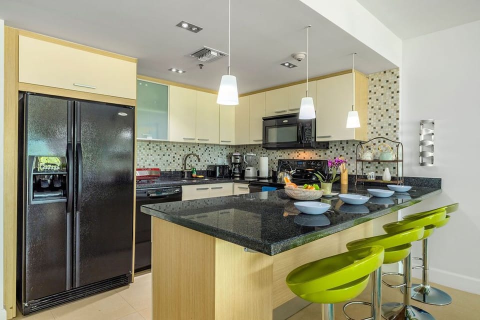 A complete kitchen with a bar.