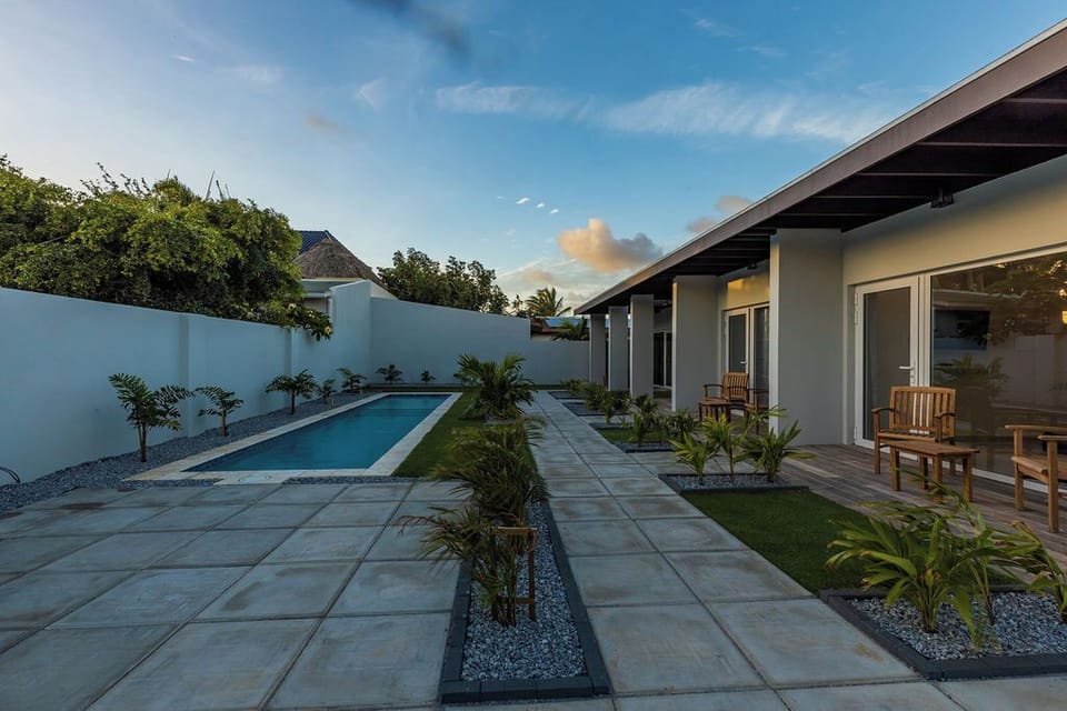 This is a NEW modern one bedroom apartment in a small private complex with four apartments in an amazing location. 
There is a shared pool and laundry area, great WiFi and air conditioning throughout, and control for each area.