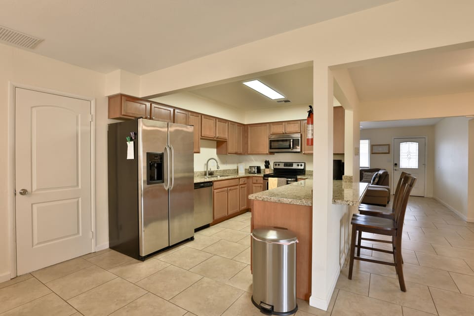 Fully stocked kitchen with stainless steel appliances