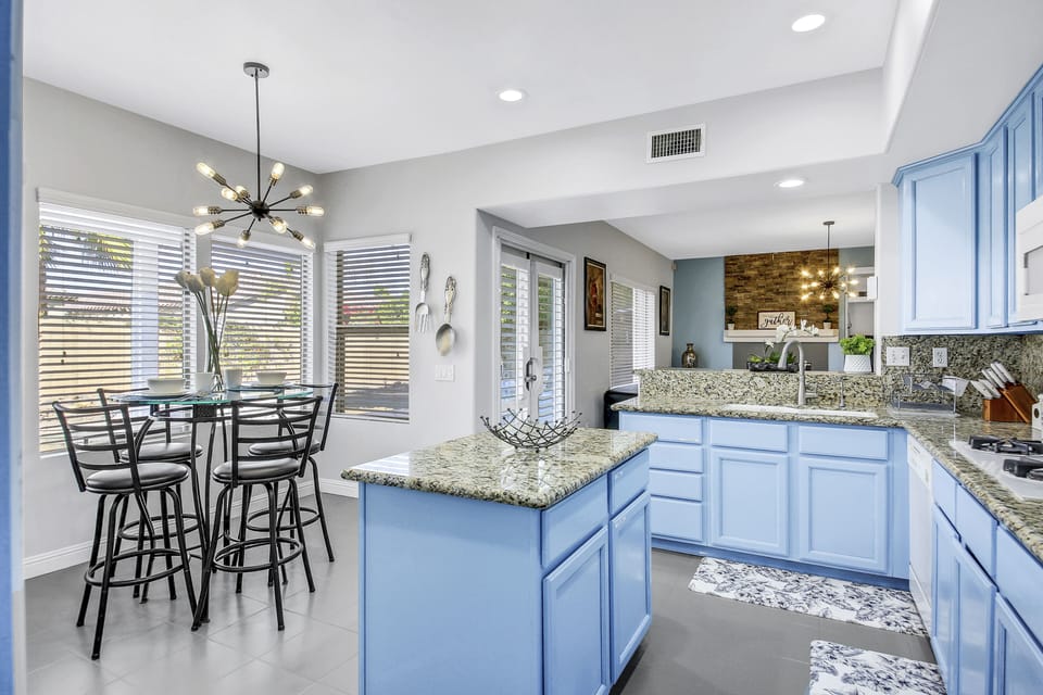 The fully-equipped kitchen features appliances such as a Samsung side-by-side refrigerator with a water and ice dispenser.