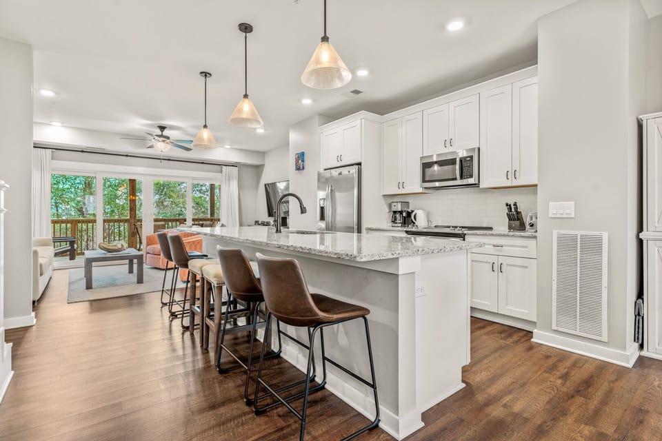 Kitchen with Bar Stool Seating on Second Level