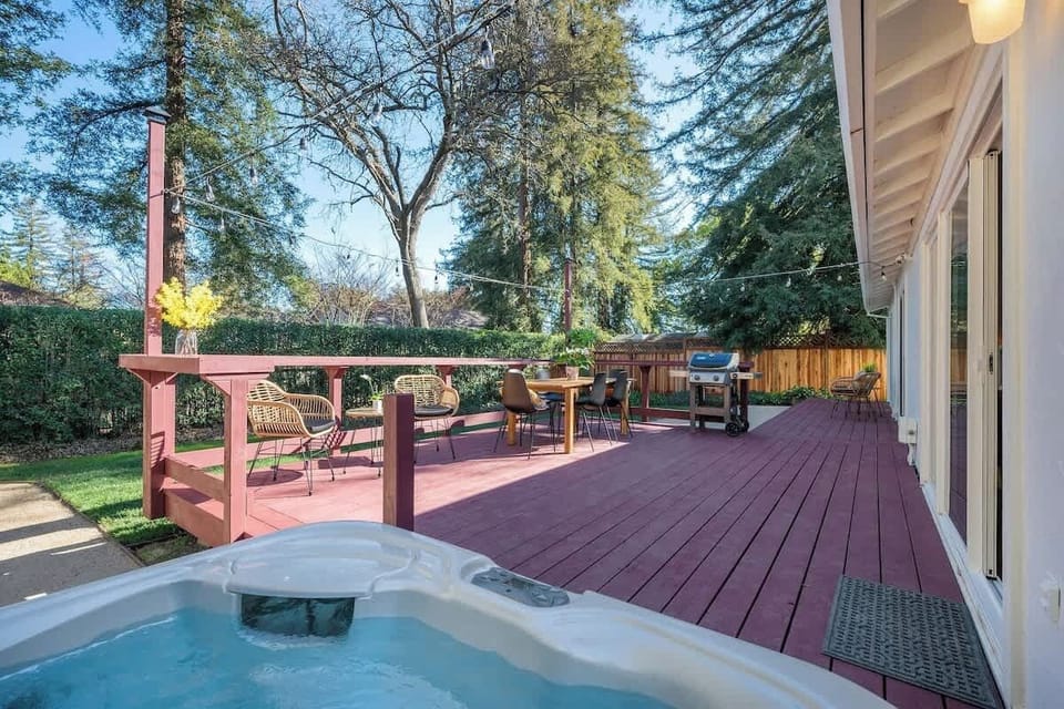 Hot tub, BBQ, and sunny deck views. Everything you need for the perfect outdoor gathering!