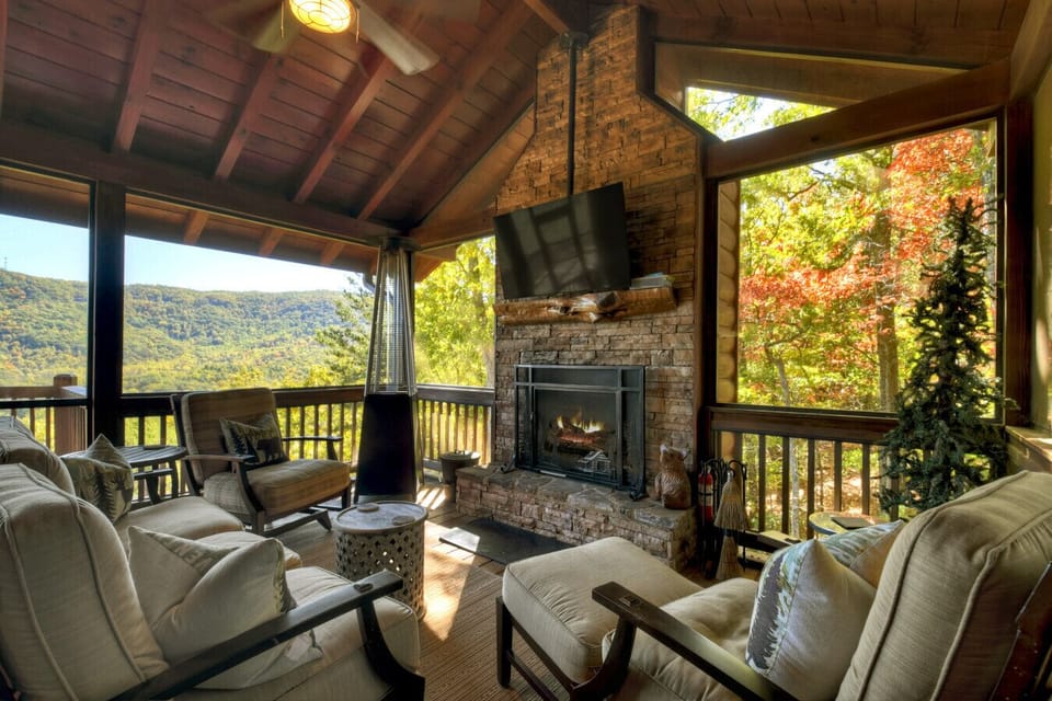 Cozy Screen porch with wood burning fireplace and flat screen TV