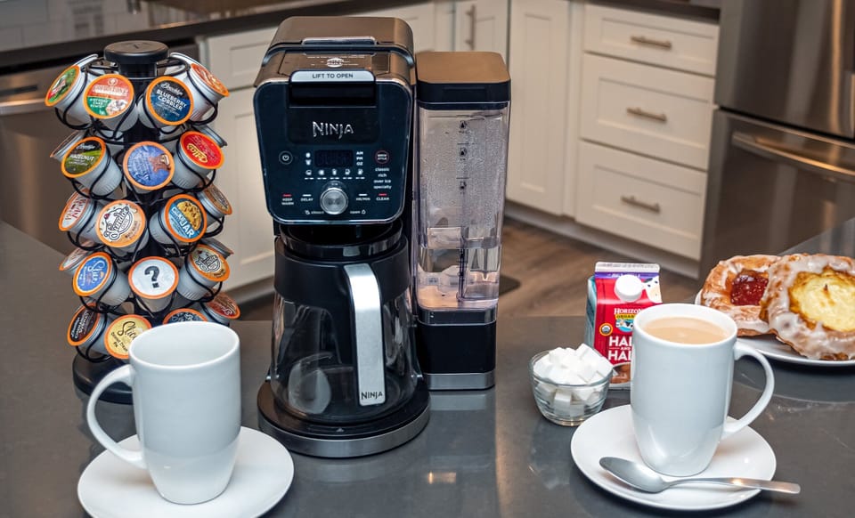 Ninja XL Dual Brew and Coffee Pods provided. All else for display purposes only.