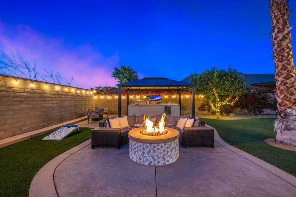 The spacious backyard has everything you need for entertainment day or night