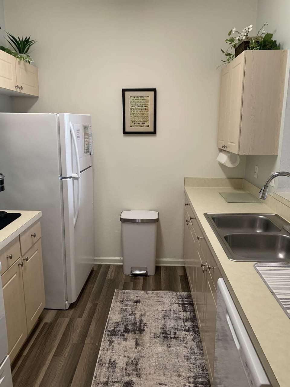 Full kitchen with microwave, stove, refrigerator, dishwasher, disposal.
