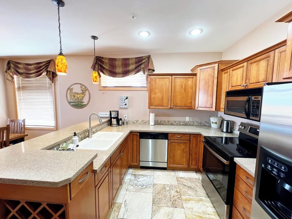 Beautiful granite counters throughout.  The kitchen has everything you'll need to entertain and keep the troops fed.  It has been very well stocked.