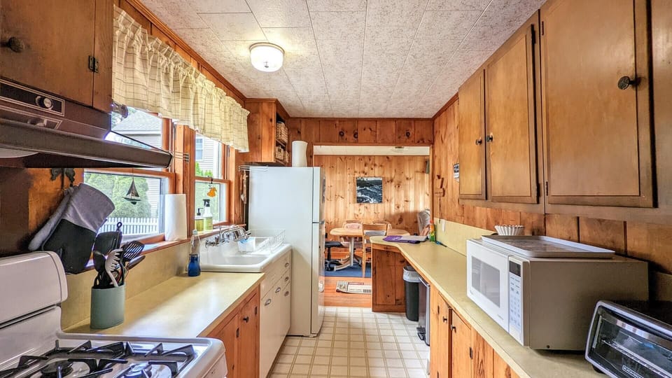 Kitchen area, opens into dining and living room