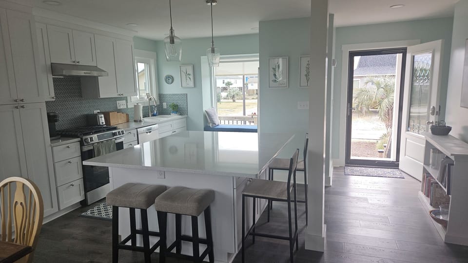 New kitchen in 2026. Quartz countertops, well-equipped. Breakfast bar seats 4.