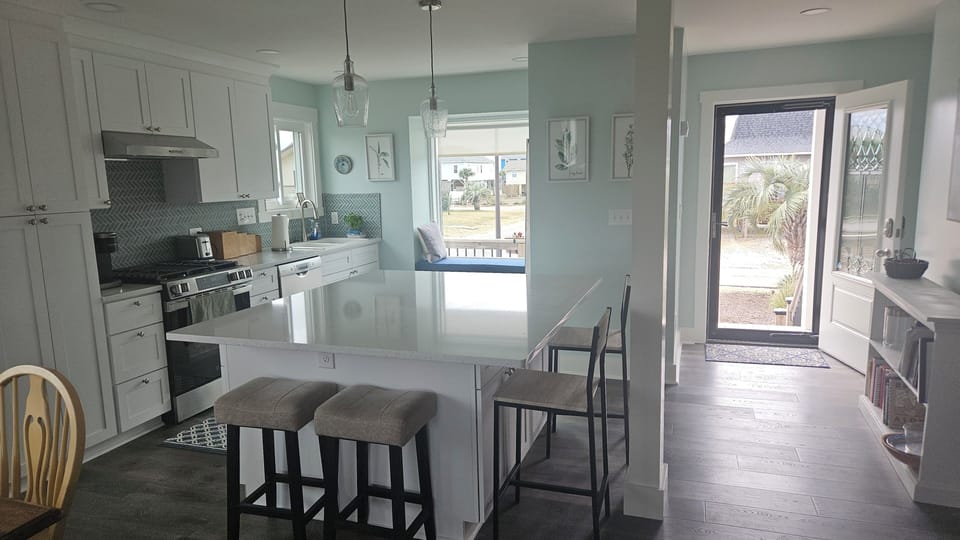 New kitchen in 2026. Quartz countertops, well-equipped. Breakfast bar seats 4.