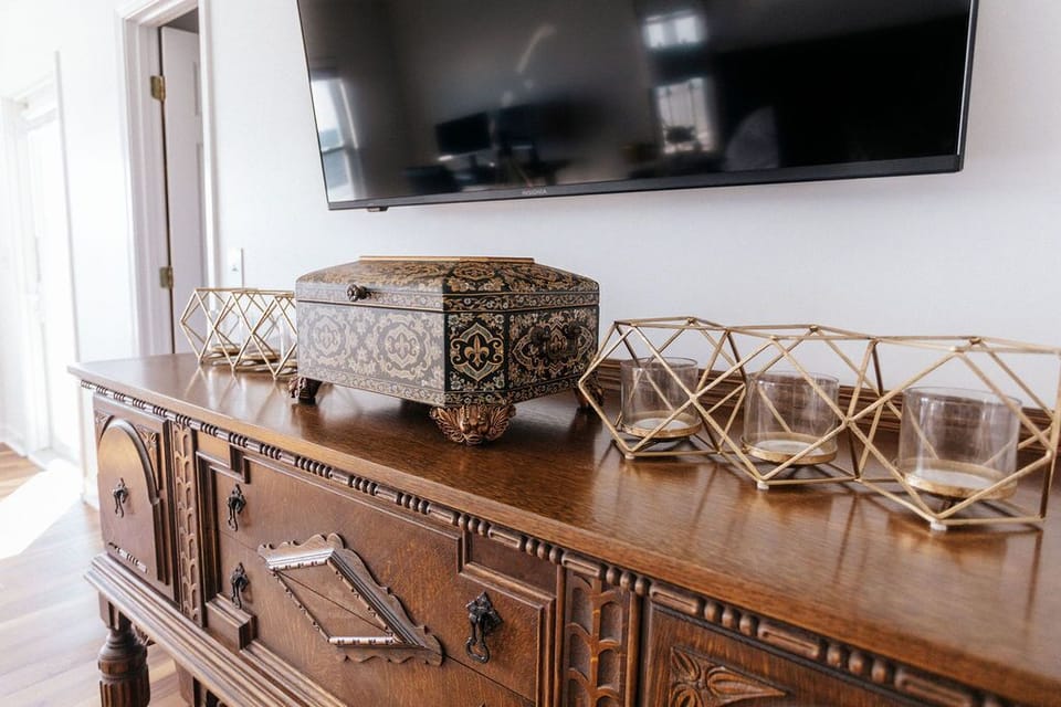 Captain's cabin.  55 inch 4K LED Smart TV, above charming antique dresser.