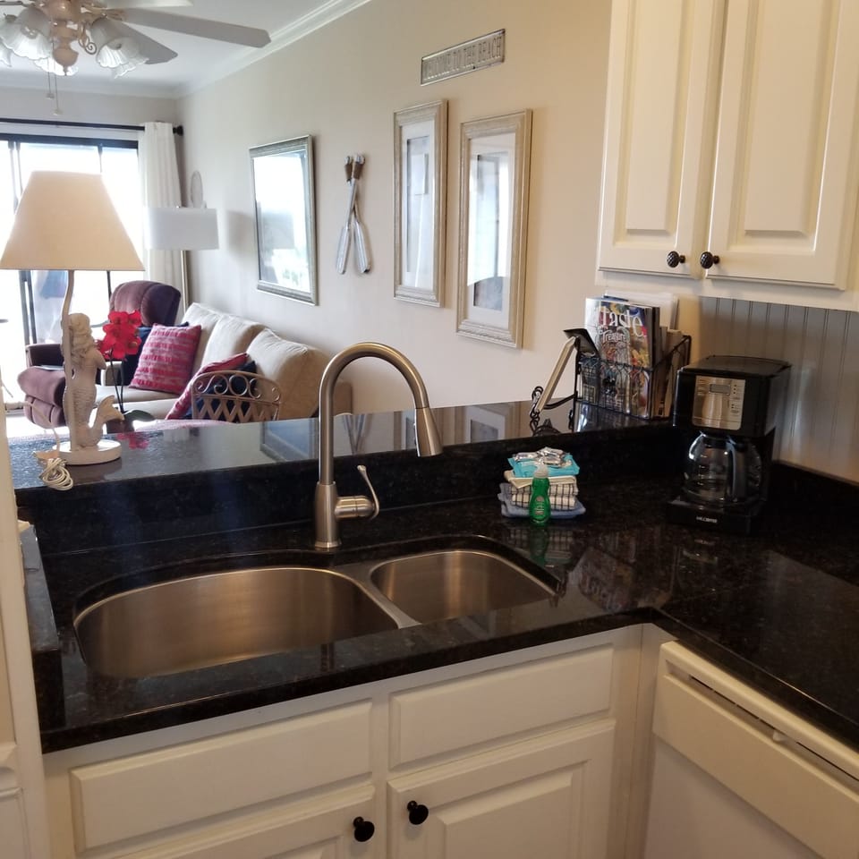 Our kitchen looking into living room  and an amazing beach/ocean view.  
