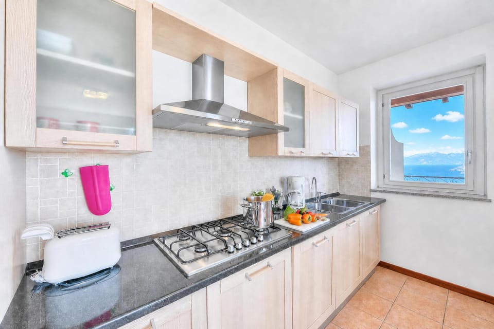 Family Apartment, 2 Bedrooms, 2 Bathrooms, Mountainside (Penthouse The Magnifique View in) | Private kitchen | Stovetop, dining table