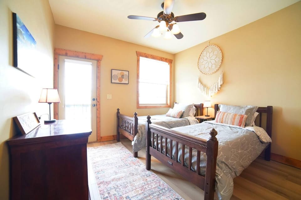 Bedroom #3 has two twin beds and access to a balcony shared with Bedroom #2.