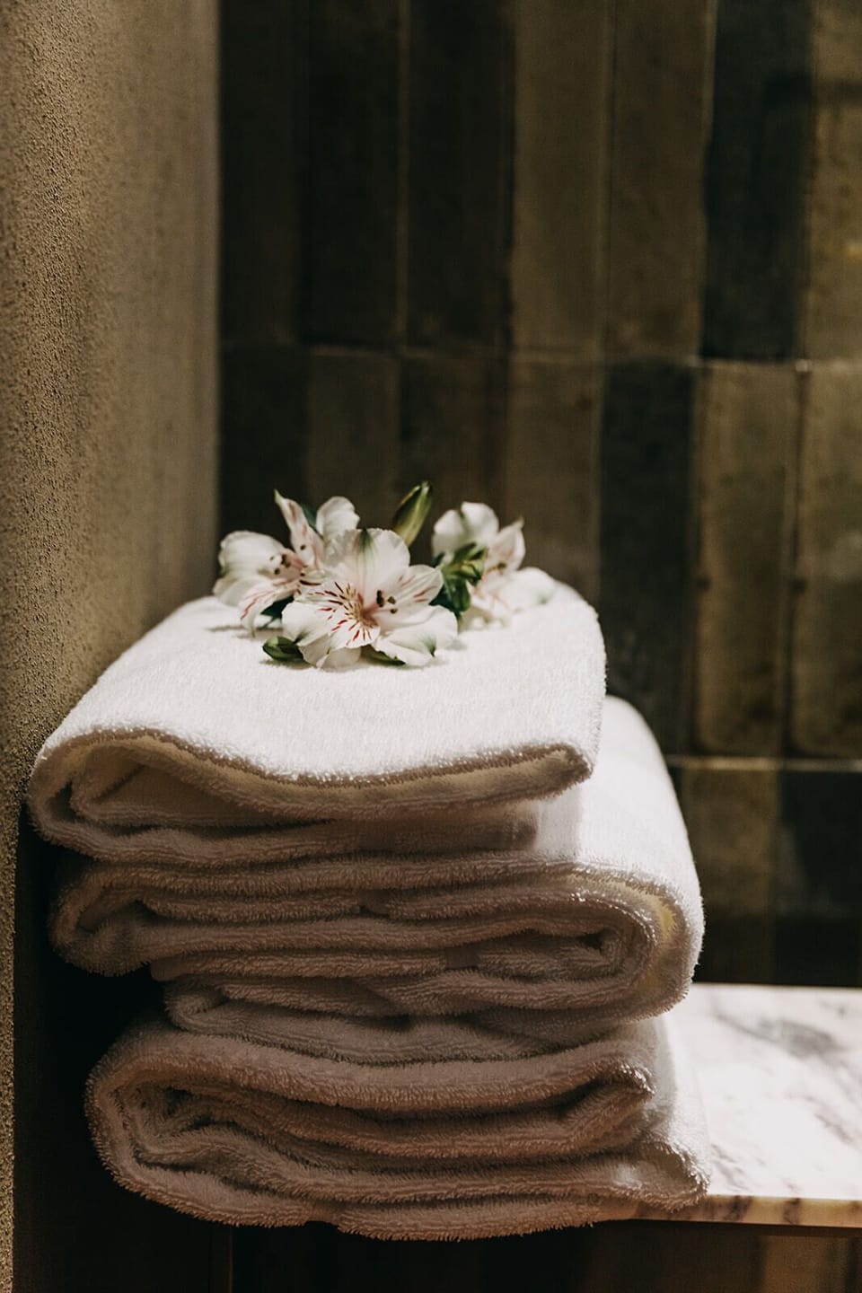 Designer toiletries, hair dryer, slippers, bidet
