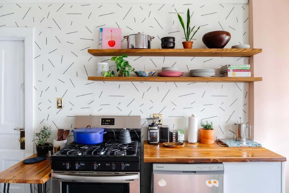 Open kitchen w/ Great Jones cookware, french press, and chef's knives