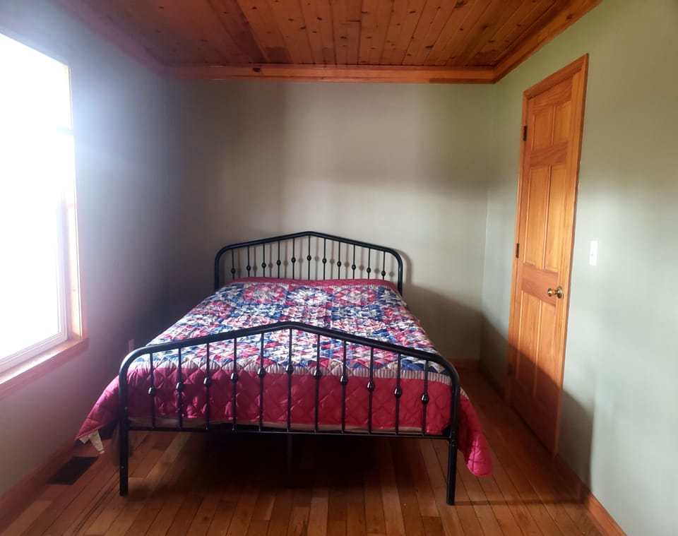 bedroom with new queen farm bed. 