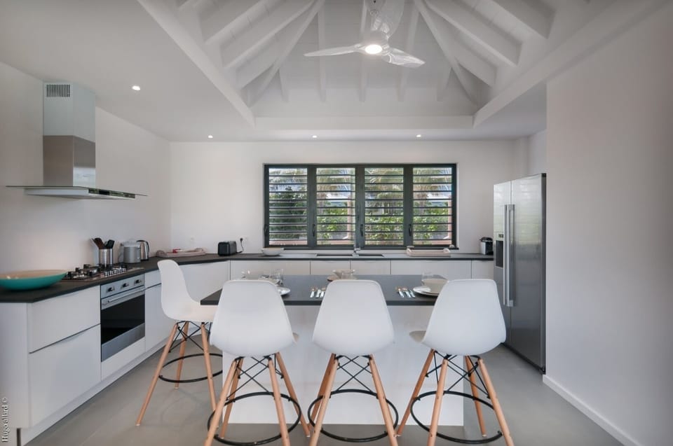 Kitchen: Fully equipped, View on the terrace and the ocean. Service for ten people.  Gas stove,