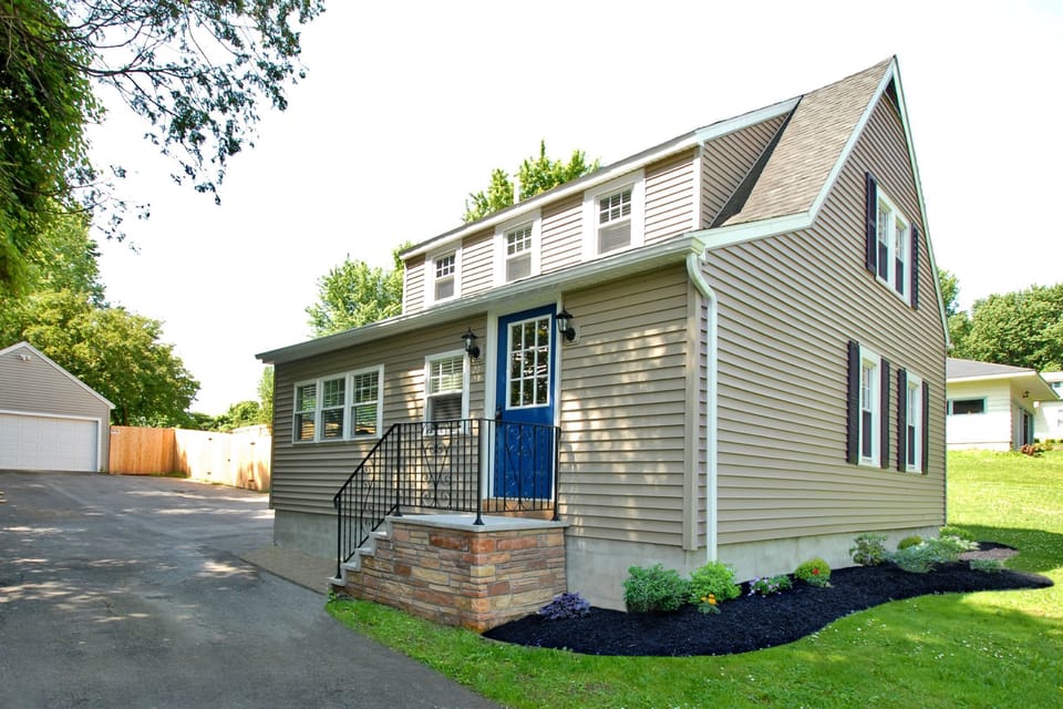 Front view of pet friendly home with plenty of parking and fenced in backyard
