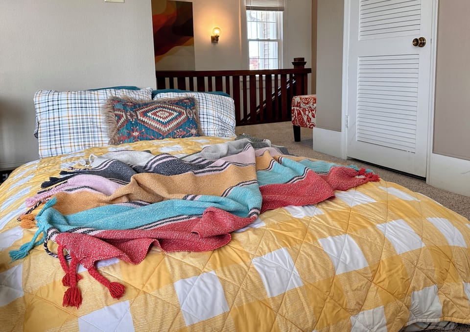 Unzip the beanbag cover, pull out the bed and make it with provided linens.