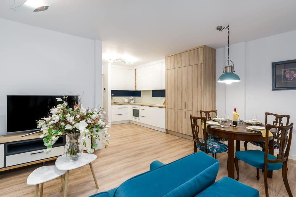 Elegant decor and vibrant flowers add charm to the inviting living space.