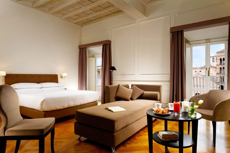 Deluxe Room | Hypo-allergenic bedding, down comforters, minibar, in-room safe