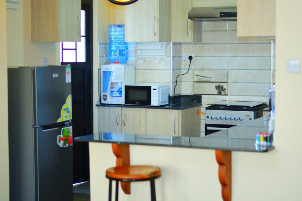 Apartment, 2 Bedrooms | Private kitchen | Full-size fridge, microwave, oven, stovetop