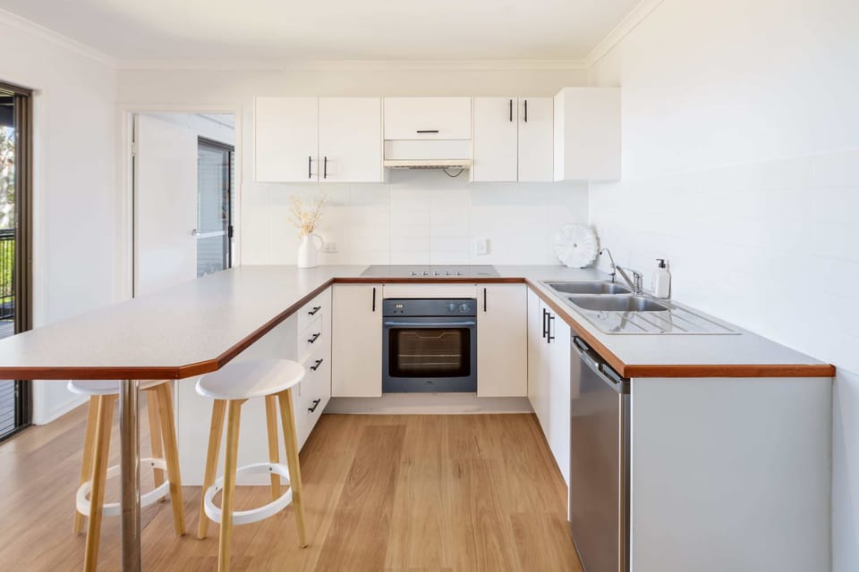 Cook and connect in the bright open kitchen designed for family living