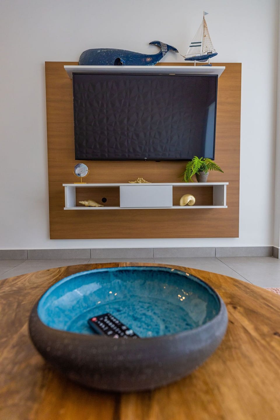 Settle in for your favorite shows on the flat-screen TV, with coastal-inspired décor adding charm to your cozy viewing area.