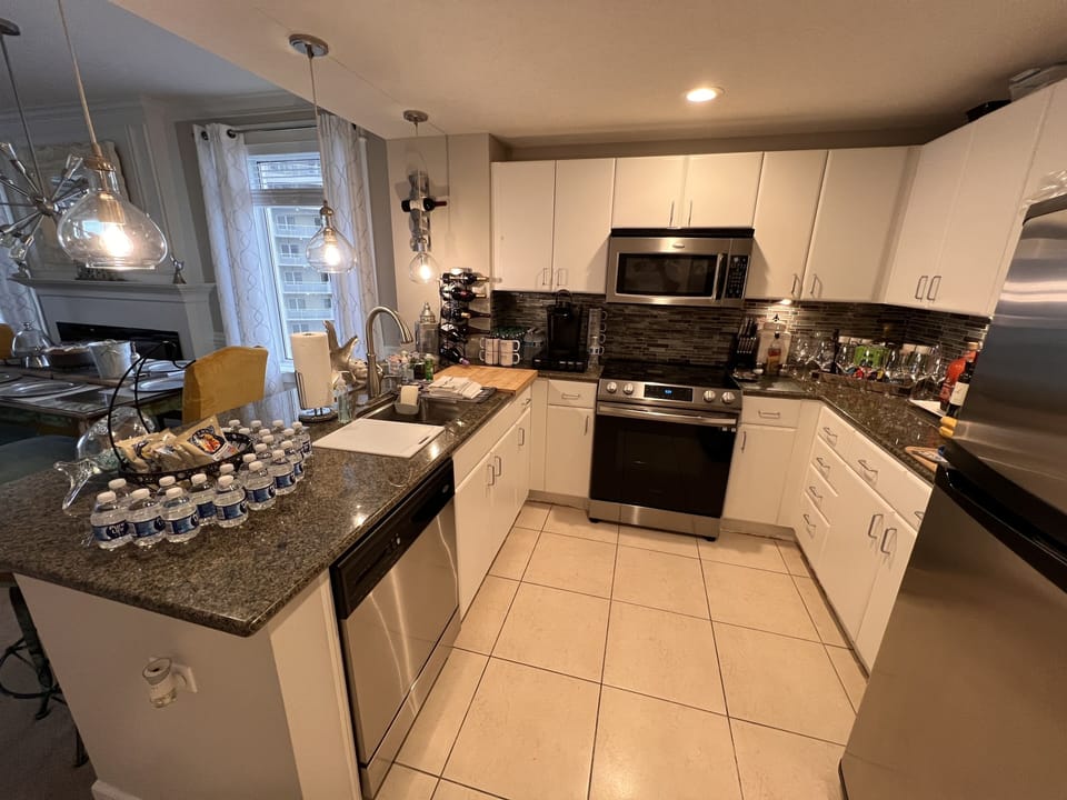 Kitchen View from hallway. Eat in counter seats 4 guests