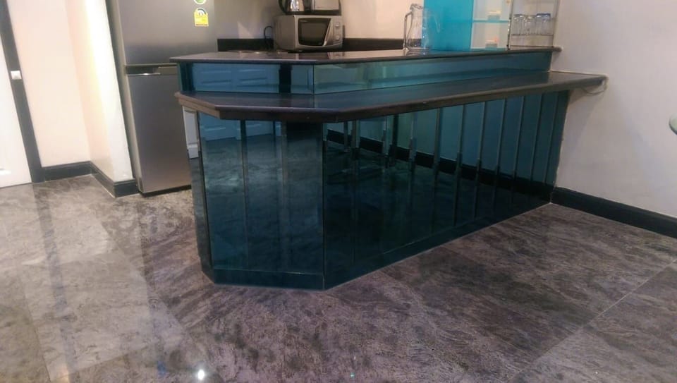 Kitchen Breakfast Bar with surrounded by blue beveled glass & granite tops