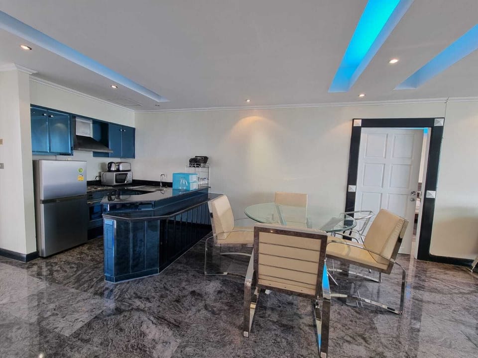 Kitchen with additional dinning area with Chrome Glass Dinning Table & Chairs