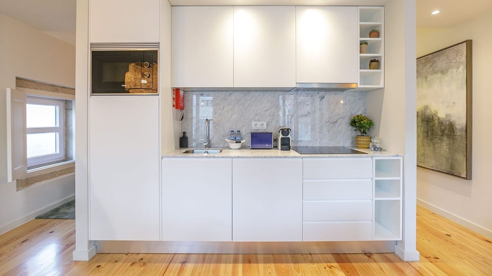 Kitchenette equipped with modern appliances like stove, microwave, toaster, Nespresso coffee machine #modern