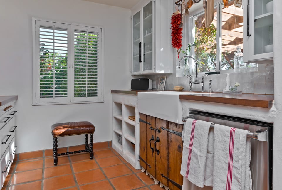 Kitchen facing private carport and front garden 