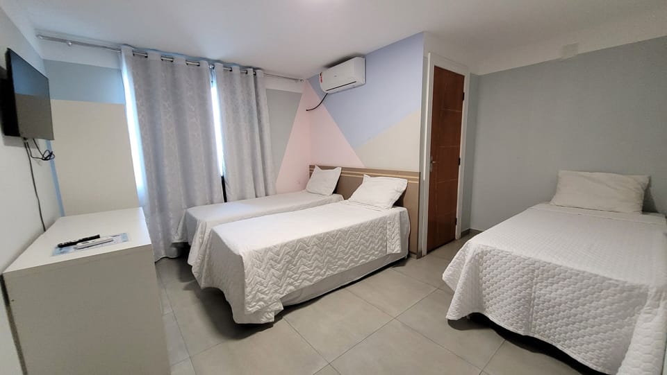 Quadruple Room | Minibar, individually decorated, desk, laptop workspace