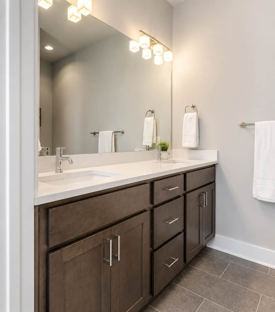 Spacious bathroom featuring a sleek double vanity—perfect for sharing.