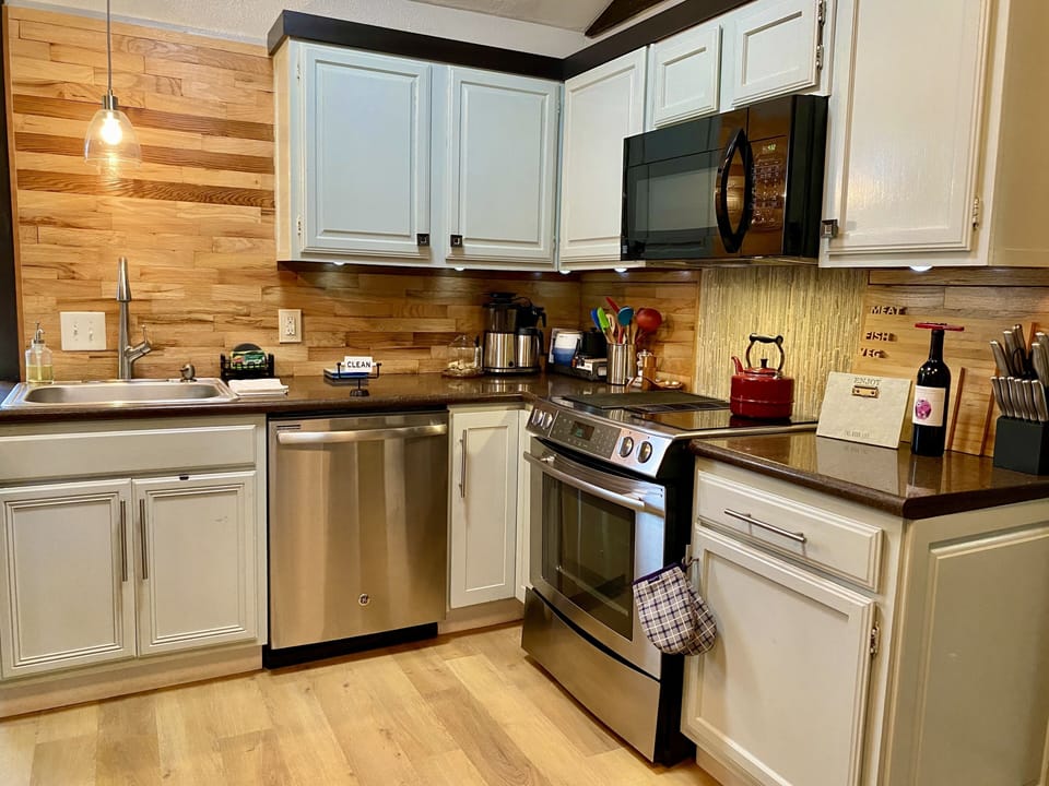 Well appointed custom kitchen with granite countertops and stainless appliances 