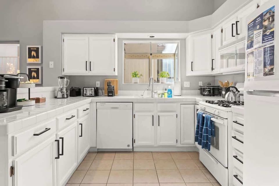 Feel right at home in our kitchen, with brand new stainless steel appliances and all the kitchenware you could need!