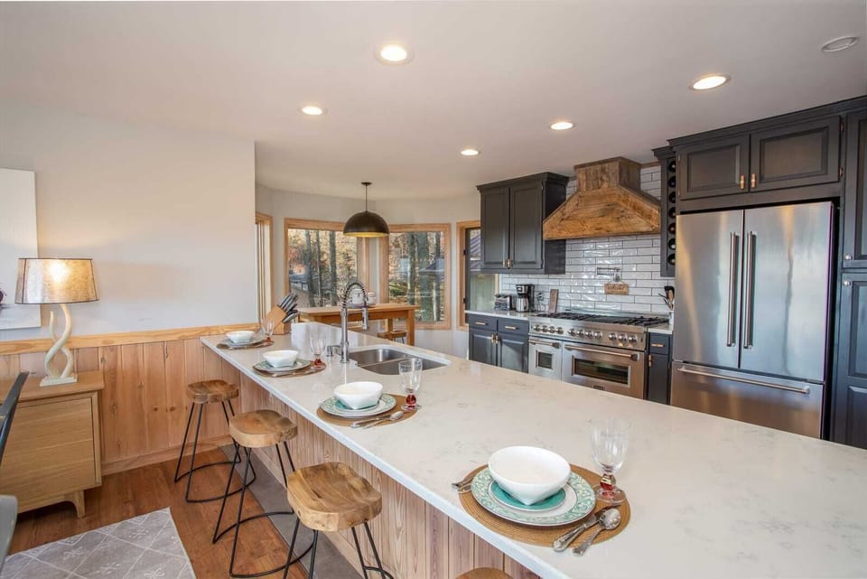 Huge Quartz Island with Barstool Seating for Four - adjacent to Dining Table