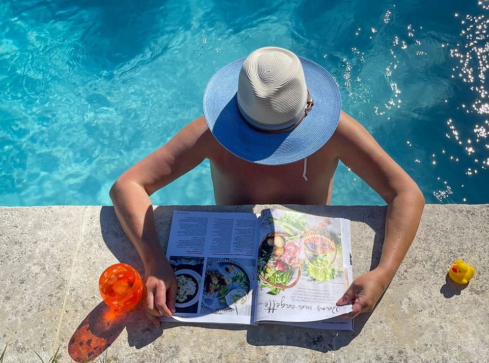Guest enjoying reading time in the pool