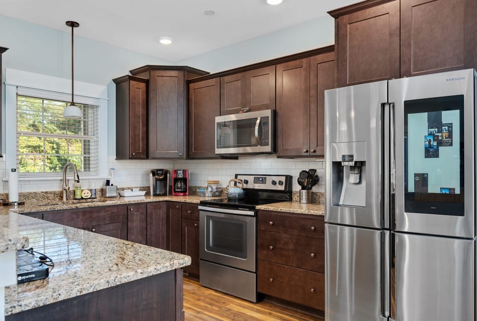 Kitchen with Bar Seating on First Level