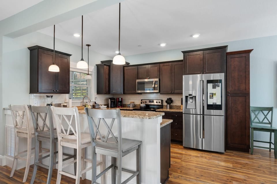 Kitchen with Bar Seating on First Level