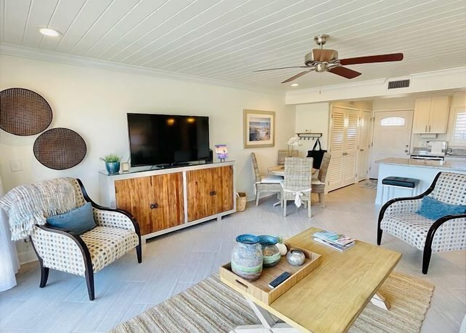 Relax in your bright, coastal-inspired living space with comfy seating, modern entertainment, and an open kitchen for easy meal prep.