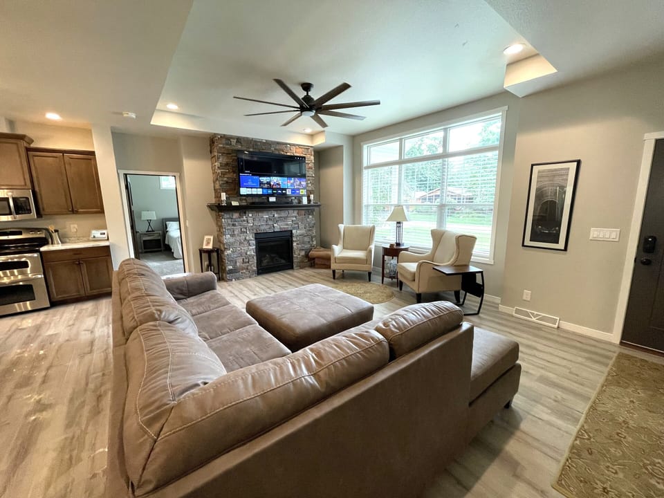 Living Room with Cozy Seating, Queen Sofa Sleeper, TV & Fireplace